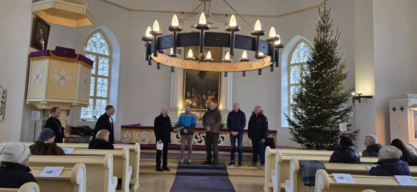 A group of people standing in a church

AI-generated content may be incorrect.