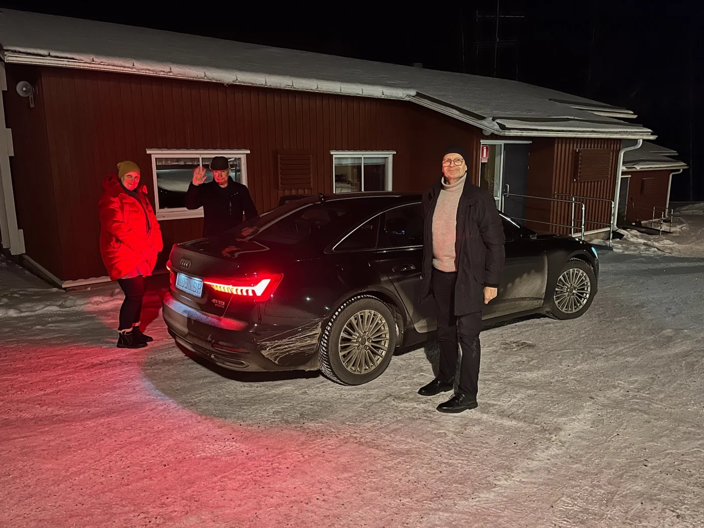 A group of people standing in front of a car

AI-generated content may be incorrect.